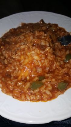 a white plate topped with rice and beans