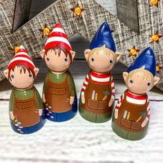 three little gnomes are standing next to each other