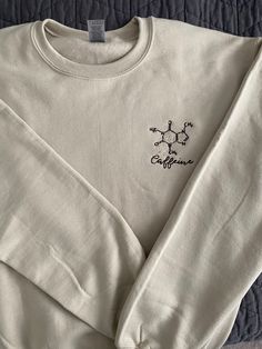 If you love caffeine as much as I do, this cute and soft sweatshirt is a great addition to your closet! Simple and wearable for everyday use ♥️ ☕️ Perfect for those science boys and gals who are either just into science or in the medical field! In these photos, I am wearing a medium when I typically am a small size! The sizes should fit as typical but they are unisex, so they tend to be looser.  Location of design is personalizable, but will come as shown if not specified. Simple Sweatshirt Design, Closet Simple, Simple Sweatshirt, Medicine Student, Painted Clothes, Medical Field, Embroidered Sweatshirt, Embroidered Sweatshirts, Sweatshirt Designs