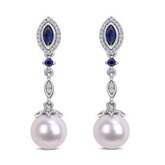 The sparkling elegance of these drop earrings will be a welcomed addition to her jewelry collection. Crafted in 10k white gold, these earrings each feature a 8.5-9mm freshwater cultured round white pearl that suspends from an intricate drop design that is made with marquise and round created blue sapphires and round diamonds. The diamonds are 1/5ctw, I or better in color, and I3 or better in clarity. Blue Pearl Earrings Fine Jewelry For Formal Events, Blue Pearl Earrings For Formal Occasions, Blue Pearl Earrings For Formal Events, Classic Blue Pearl Earrings For Anniversary, Classic Blue Pearl Drop Earrings, Classic Blue Pearl Earrings In Sterling Silver, Blue Classic Sterling Silver Pearl Earrings, Classic Blue Sterling Silver Pearl Earrings, Sapphire And Diamond Earrings