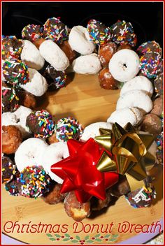 a christmas donut wreath with sprinkles and bows