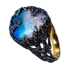 Patinated gold-plated sterling silver ring with natural Boulder Opal opal origin - Australia stone measurements - 0.47 х 0.71 in / 12 х 18 mm stone weight - 6.90 carats ring weight - 5.35 grams ring size - 8 US / 18 RUS Ivy collection Luxury Opal Ring For Gift, Blue Opal Cabochon Ring, Handmade Blue Opal Rings, Formal Blue Opal Rings, Ivy Ring, Wax Carving, Modern Ring, Boulder Opal, Gold Jewelry Fashion