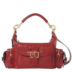 a red leather handbag with gold hardwares