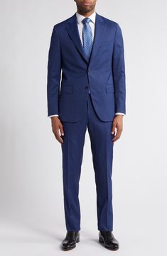 Whether it's an office occasion or a special event, this sophisticated suit crafted from luxurious wool with a hint of stretch moves with you. Jacket has front button closure; notched lapels; chest welt pocket; front flap pockets; side vents Pants have zip fly with hook-and-bar closure; front slant pockets; back button-welt pockets Unhemmed Lined 99% wool, 1% spandex Dry clean Made in Portugal Tailored Suits With Welt Pockets For Business Meetings, Single Button Suits For Business Meetings, Tailored Single Button Suit, Tailored Single-button Suit In Suiting Fabric, Business Suit With Concealed Placket In Suiting Fabric, Notch Lapel Single Button Suits For Business Meetings, Single Button Notch Lapel Suits For Business Meetings, Professional Suit With Concealed Placket For Office, Office Suit With Hidden Button Closure And Flat Front