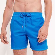 Choose a lightweight style with the Mahina men's swimsuit in plain eco-friendly material. Its fabric made from recycled plastic bottles is both responsible and ultra-lightweight. These classic men swim trunks with an elasticated waistband can be folded up into the back pocket for easy storage and transport.Ultra-light fabric packable men swimwear into the zipped back pocket to become a pouch with a Vilebrequin rubber labelElastic waistband with drawstring and Zamac tips engraved VilebrequinMen s Fitted Solid Color Swim Trunks For Water Sports, Solid Color Beachwear Swimwear For Water Sports, Solid Color Beachwear For Water Sports, Solid Beachwear Swimwear For Water Sports, Solid Color Swimwear With Upf 50+ For Water Sports, Solid Nylon Swim Trunks For Beach Season, Fitted Swim Trunks For Summer Outdoor Activities, Blue Fitted Swimwear For Outdoor, Fitted Blue Swimwear For Outdoor