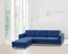 a living room with a blue couch and white walls