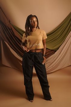 The Parachute Cargo Pant is the perfect pair to our Signature Cropped T-shirt. With 2 front and side pockets, drawstring waistband and additional belt loops, these pants are not only stylishly comfortable but super functional as well. Details: – Wide straight leg cargo pants– Elastic band with straps– Pockets on side– oversized fit – Model size 5′ 5″ wearing size S Parachute Cargo, Cargo Pant, Crop Tshirt, Drawstring Waistband, Combed Cotton, Elastic Band, Drop Shoulder, Cargo Pants, Perfect Pair