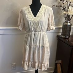 Women's Ivory Dress In Size L. Never Worn. Feminine Cream Dress For Vacation, Off White Lace Trim Dress For Day Out, Off White Dresses With Lace Trim For Day Out, Feminine Cream Mini Dress With Lace Trim, Cream Midi Dress With Lace Trim For Day Out, Cream Lace Trim Dress For Vacation, Cream V-neck Lined Dresses, Flowy Cream Dress With Lace Trim, Cream Midi Dress With Lace Trim For Vacation