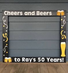 a sign that says cheers and beers to ray's 50 years