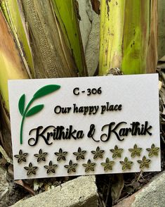 a sign that reads our happy place, kritika & kohikik