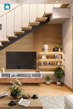 a modern living room with stairs leading up to the upper floor and television on top of it