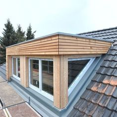 the roof of a house with wooden shingles