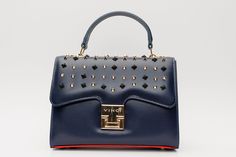 Length: 9" Height: 7" Width: 4.5" Full length of the strap : 41" Infanta Navy Blue Spike Leather Handbag: Elegance Beyond the Horizon Understated Majesty: Immerse yourself in the allure of the Infanta Navy Blue Spike Leather Handbag, meticulously crafted from 100% high-quality calf leather, bringing forth an essence of understated majesty in every detail. Artistic Spike Embellishments: The flap boasts meticulously placed navy blue and gold spikes, creating an artistic arrangement that adds a dar Luxury Navy Shoulder Bag With Handles, Navy Formal Shoulder Bag With Detachable Strap, Formal Navy Shoulder Bag With Detachable Strap, Navy Rectangular Shoulder Bag For Evening, Navy Rectangular Evening Shoulder Bag, Luxury Navy Shoulder Bag For Evening, Designer Navy Bag For Evening, Designer Navy Evening Bag, Blue Leather Shoulder Bag For Party