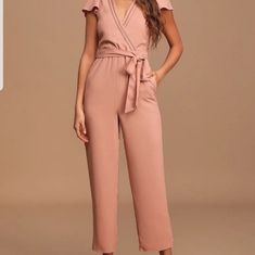 Nwt. Size Small Jumpsuit In Mauve/Pink With Short Flounce Sleeves, A Darted Bodice, And A Surplice Neckline, Trimmed With Pierced Crochet Details. Fitted Waist, With Tying Sash Belt, Wide-Leg Pants That End In Ankle-Length, Slightly Tapered Hems. Hidden Back Zipper/Clasp. -Currently Sold Out. -Fully Lined. -Self & Lining: 100% Polyester. Pink V-neck Jumpsuit For Loungewear, Feminine Fitted Jumpsuits And Rompers For Workwear, Feminine Fitted Jumpsuits For Workwear, Fitted Pink Jumpsuits And Rompers For Work, Fitted Pink Jumpsuits For Work, Pink Fitted Jumpsuit For Work, Pink V-neck Jumpsuits For Work, Chic Pink Jumpsuits And Rompers With Tie Waist, Chic Pink Jumpsuit With Tie Waist