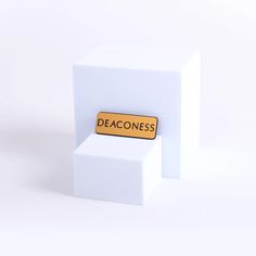 a white box with a sign that says deaconess