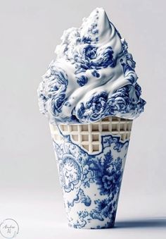 an ice cream cone with blue and white designs