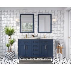 a bathroom with white tile and blue vanity cabinets, black and white rugs and potted plants