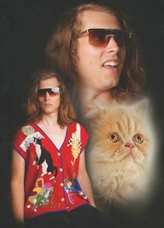 a man with sunglasses and a cat in front of him