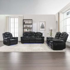 the living room is clean and ready to be used as a family room area with black leather furniture