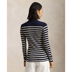 Featuring an allover ribbed texture this slim-fitting turtleneck features horizontal stripes and is embroidered with an anchor and our signature monogram logo at the hem. Striped Fitted Top With Ribbed Cuffs, Fitted Striped Tops With Ribbed Cuffs, Fitted Striped Top With Ribbed Cuffs, Classic Striped Tops For Layering, Classic Striped Tops With Ribbed Cuffs, Fitted Striped Tops With Ribbed Collar, Classic Winter Tops With Contrast Stripes, Classic Fitted Tops With Signature Stripes, Fitted Striped Ralph Lauren Top