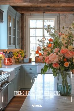 a vase filled with flowers sitting on top of a kitchen counter