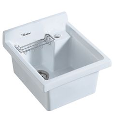 a white sink sitting under a faucet