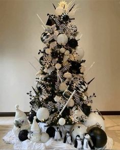 a christmas tree with black and white ornaments