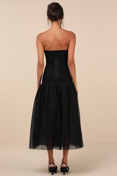 The Rare London Beautifully Poised Black Tulle Ruched Drop Waist Midi Dress will make you the belle of the ball whenever you want! Sheer tulle-mesh fabric (atop a matching bandage knit liner) shapes this lovely dress that features a strapless, ruched bodice with a straight neckline and hidden no-slip strips. The fitted silhouette continues down to a trendy drop waist that sits atop a voluminous A-line skirt with a chic midi hem. Hidden back zipper/clasp. Fit: This garment fits true to size. Length: Mid-calf length. Size medium measures 44.5" from top to bottom. Bust: Great for any cup size. Waist: Fitted - very fitted at natural waist. Hip: Loosely Fitted. Undergarments: May be worn with a strapless bra, adhesive bra, petals, or no bra. Fabric: Fabric has some stretch. Unlined. Shell: 95% Holiday Formal Dresses, Velvet Holiday Dress, Holiday Dresses Women, Christmas Dress Women, Eve Dresses, New Years Eve Dresses, Adhesive Bra, Black Tulle, Straight Neckline