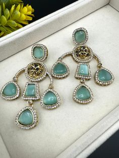 This a beautiful Premium Sabyasachi inspired Mint Green/Light Green colored earring with Monalisa Stone and CZ detailed work. It is a statement earring with stunning designer look which makes it a must to have in your collection. This is so beautiful to look at and a perfect one for Indian weddings.  Color : Light Green/Mint Green, Gold length : 3.5 inch width : 2.25 inch Each earring Weight : 27 grams Material : Brass , CZ, Monalisa Stones Beautiful High Quality, premium jewelry. Free US standa Chand Bali, Earring Bridal, Earring Long, Bridal Earring, Organza Lehenga, Long Chandelier, Gold Chandelier Earrings, Bali Earrings, Premium Jewelry