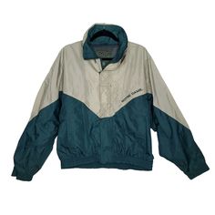 Vintage Notre Dame Windbreaker Jacket Sz M Green Tan Zip Up w/ Hook & Loop Closure, Stow Away Hood Approximate Flat Measurements Underarm to Underarm: 25" Overall Length From Back of Neck: 26" Not much elasticity left in sleeve cuffs - 5.25" Flat Width Green Casual Nylon Hooded Jacket, Green Nylon Hooded Jacket Casual, Retro Long Sleeve Windbreaker For Outdoor Activities, Vintage Long Sleeve Track Jacket For Outdoors, Retro Nylon Outerwear For Outdoor Activities, Retro Nylon Track Jacket For Outdoor, Retro Long Sleeve Outerwear For Outdoor Activities, Green Track Jacket With Adjustable Hood For Winter, Retro Outdoor Track Jacket With Long Sleeves