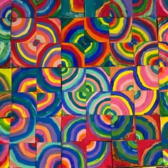 an abstract painting with many different colors and shapes on the surface, including circles in red, blue, green, yellow, orange