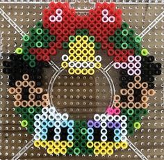 a cross stitch bead pattern with the letter o