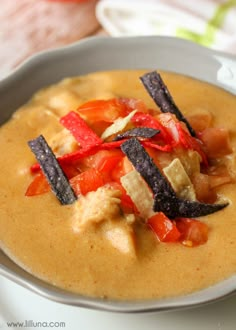 a white bowl filled with food on top of a table