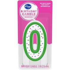 a birthday candle with the number 0 on it's front and back cover in green