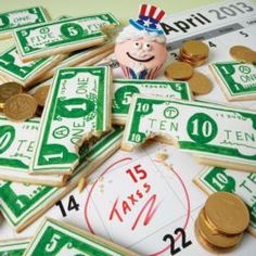 a pile of green and white money sitting next to each other on top of a table