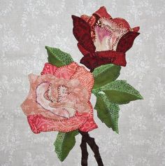 two red roses with green leaves on a white wallpapered background, one is pink and the other is brown