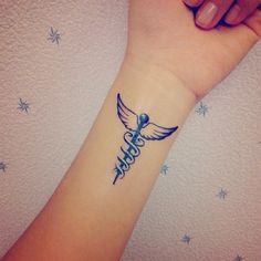 a woman's arm with a tattoo on it that says hope and an angel