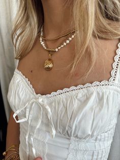 - 18k Gold Plated - Stainless Steel Filled - Water-resistant - Hypoallergenic made to wear everyday. White Dainty Chain Necklace For Everyday, Dainty White Chain Necklace For Everyday, Chic White Necklaces For Layering, White Everyday Necklaces With Delicate Chain, Everyday Teardrop Gold Plated Necklace, Everyday Gold Plated Teardrop Necklace, Everyday White Tarnish Resistant Chain Necklace, Everyday Layered Pearl Chain Necklace, Chic White Layering Necklaces