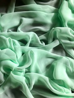 "1 mtr mint green chiffon fabric This is quality chiffon fabric It is 45\" wide (114cm) This is ideal for dress making,bridal dress, veils,decorations,and many other projects If more than one quantity is bought it will be sent in one continous length I also combine postage costs if multiple items are bought Any questions feel free to ask" Bridal Horseshoe, Mint Green Dress, Pink Wedding Theme, Dried Rose Petals, Bridal Fabric, Soft Dress, Blossom Design, Stage Costume, Dress Chiffon