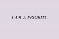 the words i am a priority are in black and white on a light purple background