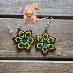 Black Flower-shaped Jewelry With Colorful Beads, Orange Beaded Earrings With Black Beads, Green And Black Beaded Earrings For Gifts, Yellow Beaded Earrings With Black Beads, Green Beaded Earrings With Black Beads For Gift, Colorful Beaded Flower-shaped Earrings, Green Flower-shaped Beaded Earrings, Multicolor Flower-shaped Beaded Earrings, Multicolor Flower Shaped Beaded Earrings