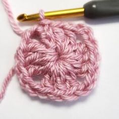 the crochet is being worked on with a needle