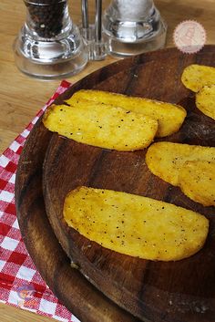 some fried food is on a wooden plate