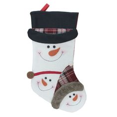 two snowmen wearing hats and scarfs hanging from a christmas stocking