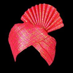 a red and gold fan shaped object on a black background in the shape of a headdress