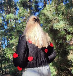 This hand knit women's cropped cardigan with red hearts will be the perfect addition to your look. Can be worn with dresses or jeans. In such an original button-down sweater you will definitely be noticed 100% hand made Model height 165 cm / 65 " and is wearing size M. YARN:  50 % merino wool, 50% acriliс Sweater measurements for size XS (measurements taken in a horizontal position and without stretching): Length: 40 cm / 15,7". Bust Width: 85 cm / 33.4"  Sweater measurements for size S (measurements taken in a horizontal position and without stretching): Length: 45 cm / 17,7". Bust Width: 90 cm / 35.4"  Sweater measurements for size M (measurements taken in a horizontal position and without stretching): Length: 45 cm / 17,7". Bust Width: 95 cm / 37.4" . Sweater measurements for size L (me Red And Black Heart Sweater, Red Hearts, Cropped Cardigan, Black Cardigan, Red Heart, Stretching, Women Crop, Hand Knitting, Merino Wool