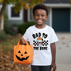 Bad To The Bone Skeleton Shirt, Halloween Kids Shirt, Halloween Shirt, Skeleton Shirt, Cute Halloween Shirt, Spooky Season Tee, Skull Shirt Add a touch of style to your wardrobe with this premium quality t-shirt. Made with soft and comfortable material, this T-shirt is perfect for all-day wear. Featuring a classic fit and versatile design, it can be dressed up or down to suit any occasion. Whether you're running errands or hitting the town, this T-shirt is a must-have for any fashion-forward individual. Order now and experience the ultimate in comfort and style. Care Instructions: To care for your item, wash it inside out in cold water, do not bleach, do not dry clean, and do not iron directly on the design. Your order is being prepared with care and attention to detail. We use products fr To The Bone, Skull Shirt, Bad To The Bone, Skeleton Shirt, Skull Shirts, The Bone, Quality T Shirts, Halloween Kids, Cute Halloween