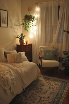 a bedroom with a bed, chair and plants in the corner on the windowsill