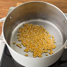 a pan on top of a stove with some food in it that is being cooked