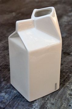 a white milk container sitting on top of a table